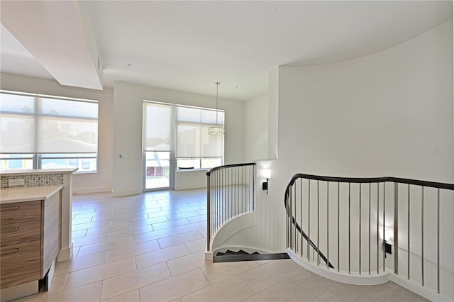 221 Cosmopolitan Ct, Sarasota, FL 34236 - stairs featuring tile patterned flooring and baseboards