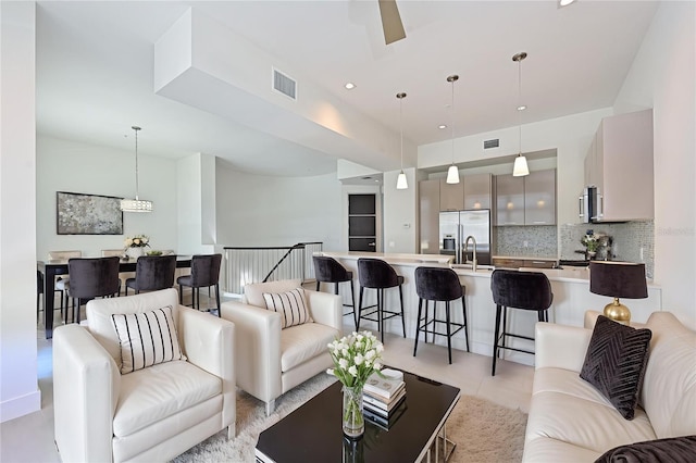 221 Cosmopolitan Ct, Sarasota, FL 34236 - living room featuring recessed lighting, visible vents, and ceiling fan