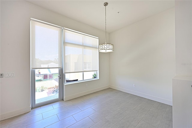 221 Cosmopolitan Ct, Sarasota, FL 34236 - unfurnished dining area featuring baseboards