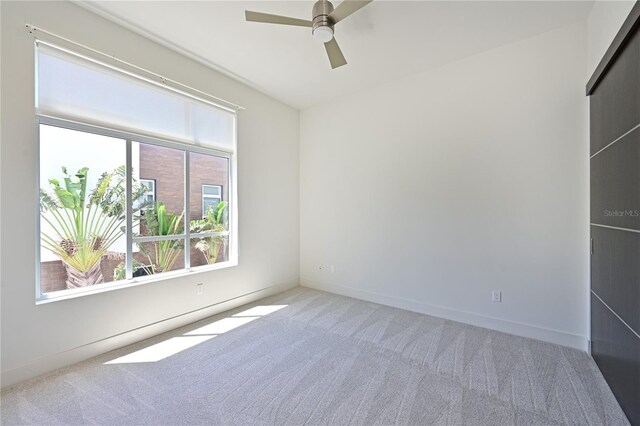 221 Cosmopolitan Ct, Sarasota, FL 34236 - empty room featuring carpet floors, a ceiling fan, and baseboards