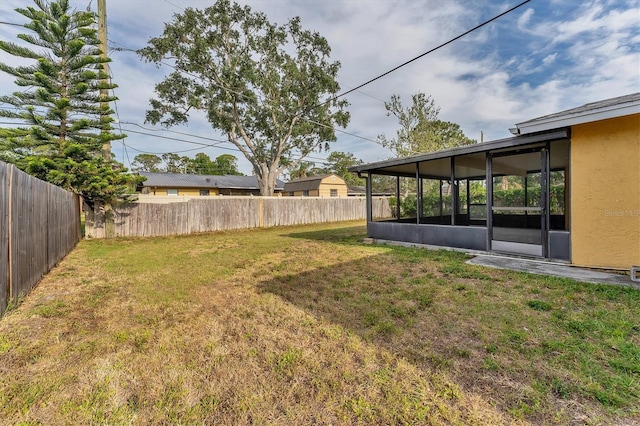 2151 Upton Ave, Sarasota, FL 34232 - view of yard with a fenced backyard and a sunroom