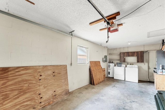 2151 Upton Ave, Sarasota, FL 34232 - interior space featuring washer and dryer, a garage, concrete block wall, a textured ceiling, and water heater