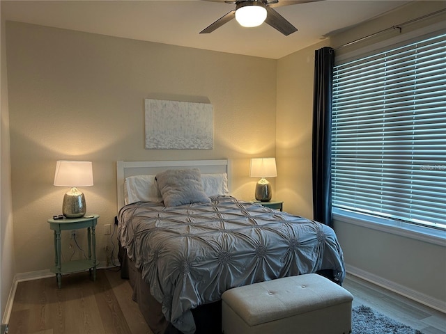 4166 Central Sarasota Pkwy Unit 535, Sarasota, FL 34238 - bedroom featuring wood finished floors, baseboards, and a ceiling fan