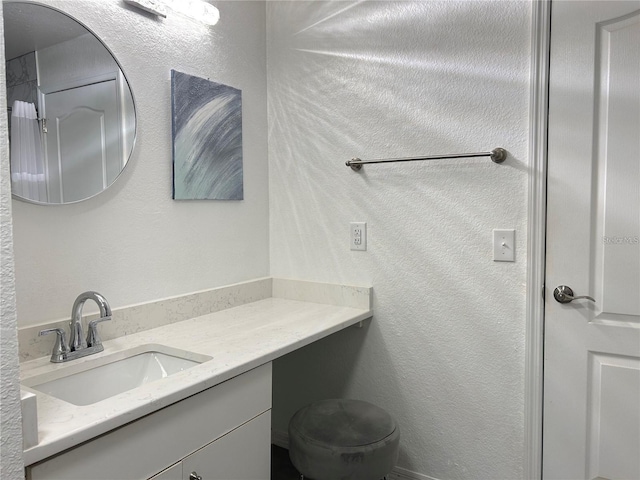 4166 Central Sarasota Pkwy Unit 535, Sarasota, FL 34238 - bathroom featuring vanity and a textured wall