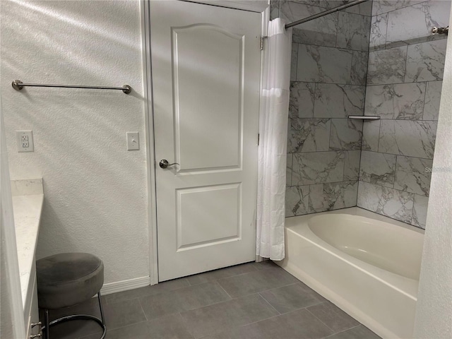 4166 Central Sarasota Pkwy Unit 535, Sarasota, FL 34238 - full bathroom featuring shower / tub combo, a textured wall, baseboards, and tile patterned floors