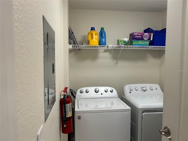 4166 Central Sarasota Pkwy Unit 535, Sarasota, FL 34238 - laundry area featuring a textured wall, separate washer and dryer, laundry area, and electric panel