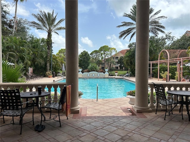 4166 Central Sarasota Pkwy Unit 535, Sarasota, FL 34238 - community pool featuring a patio