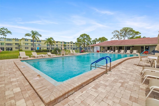 4885 1st St NE Unit 308, Saint Petersburg, FL 33703 - pool featuring a patio and fence