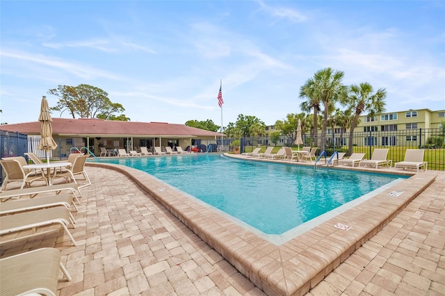 4885 1st St NE Unit 308, Saint Petersburg, FL 33703 - community pool with a patio and fence