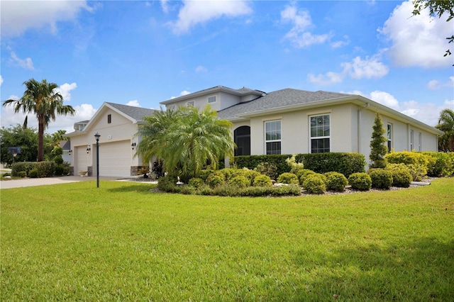 2918 130th Ave E, Parrish, FL 34219 - view of front facade with a garage, a front yard, concrete driveway, and stucco siding