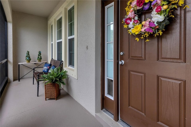 2918 130th Ave E, Parrish, FL 34219 - doorway to property featuring stucco siding
