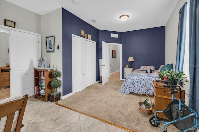 2918 130th Ave E, Parrish, FL 34219 - bedroom with a closet, tile patterned flooring, and carpet floors