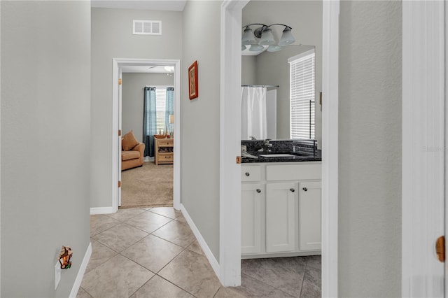 2918 130th Ave E, Parrish, FL 34219 - corridor featuring baseboards and light tile patterned floors