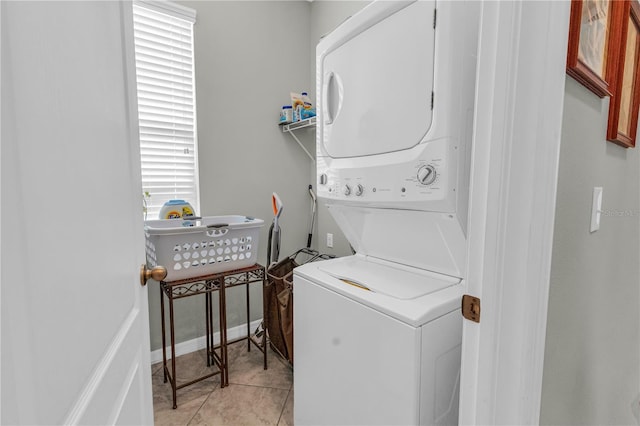 2918 130th Ave E, Parrish, FL 34219 - laundry room featuring estacked washer and dryer and light tile patterned flooring