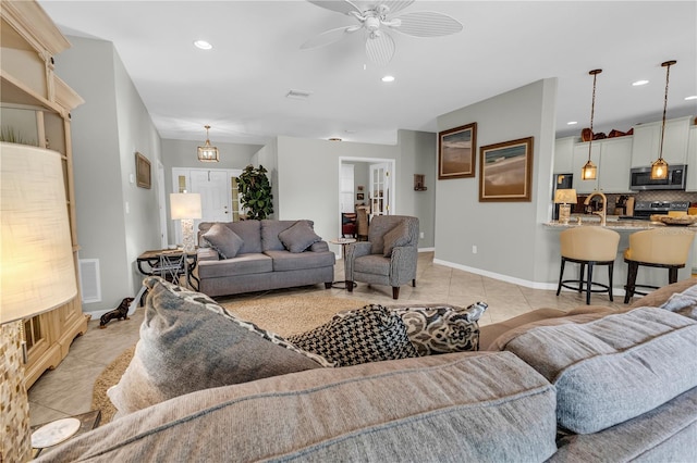 2918 130th Ave E, Parrish, FL 34219 - living area with light tile patterned floors, ceiling fan, and recessed lighting