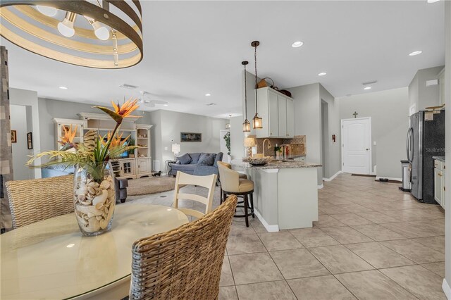 2918 130th Ave E, Parrish, FL 34219 - dining room featuring light tile patterned floors and recessed lighting