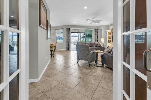 2918 130th Ave E, Parrish, FL 34219 - living room featuring light tile patterned floors, ceiling fan, and recessed lighting