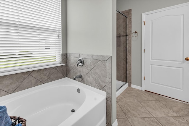 2918 130th Ave E, Parrish, FL 34219 - full bath featuring a bath, tile patterned floors, and a stall shower