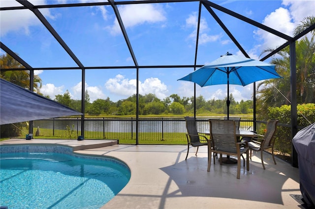 2918 130th Ave E, Parrish, FL 34219 - view of swimming pool featuring a patio, a water view, and glass enclosure