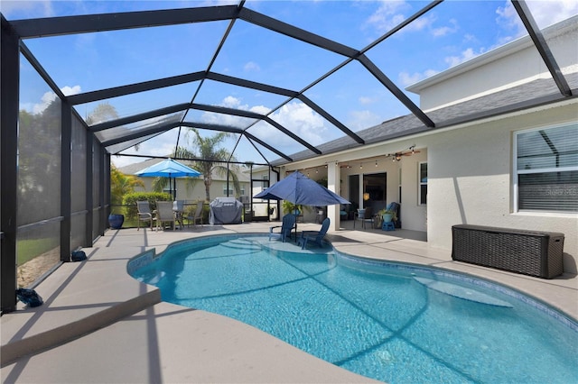 2918 130th Ave E, Parrish, FL 34219 - outdoor pool with a patio area, outdoor dining space, glass enclosure, and ceiling fan