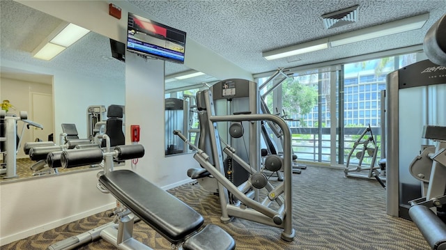 workout area featuring a textured ceiling, carpet, and visible vents