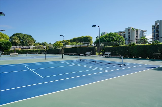 view of sport court featuring community basketball court and fence