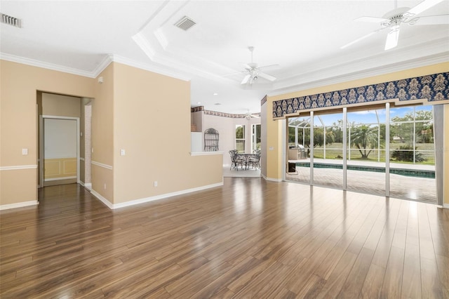 244 Dove Trl, Bradenton, FL 34212 - unfurnished living room featuring ceiling fan, ornamental molding, and wood finished floors