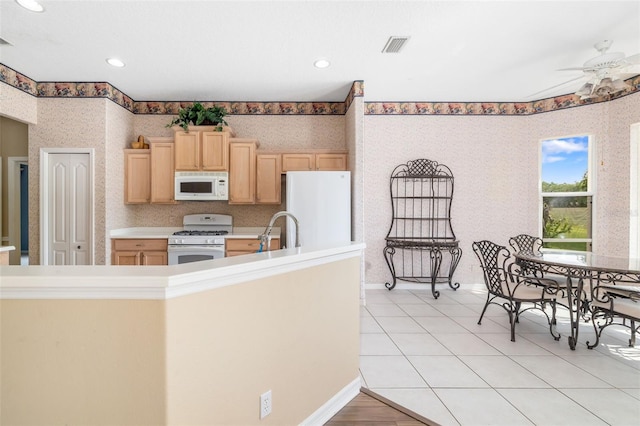 244 Dove Trl, Bradenton, FL 34212 - kitchen featuring white appliances, wallpapered walls, light brown cabinetry, a ceiling fan, and recessed lighting