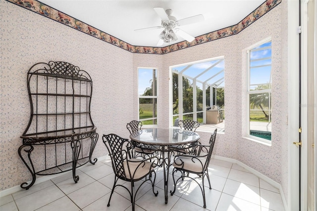 244 Dove Trl, Bradenton, FL 34212 - tiled dining space with a sunroom, wallpapered walls, and ceiling fan