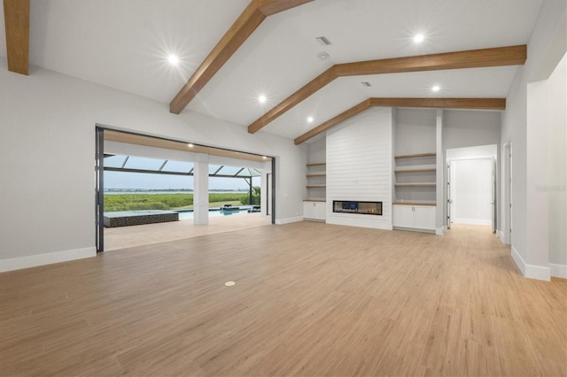 1613 4th St E, Palmetto, FL 34221 - unfurnished living room featuring beam ceiling, baseboards, light wood-style flooring, a large fireplace, and recessed lighting