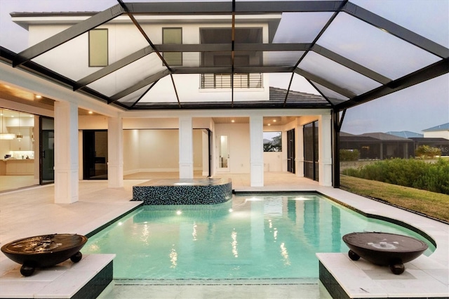 1613 4th St E, Palmetto, FL 34221 - view of pool with a patio area, glass enclosure, and a pool with connected hot tub