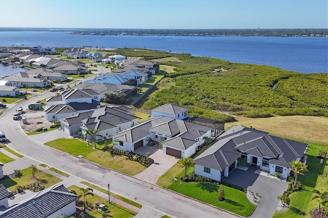 1613 4th St E, Palmetto, FL 34221 - aerial perspective of suburban area featuring a large body of water