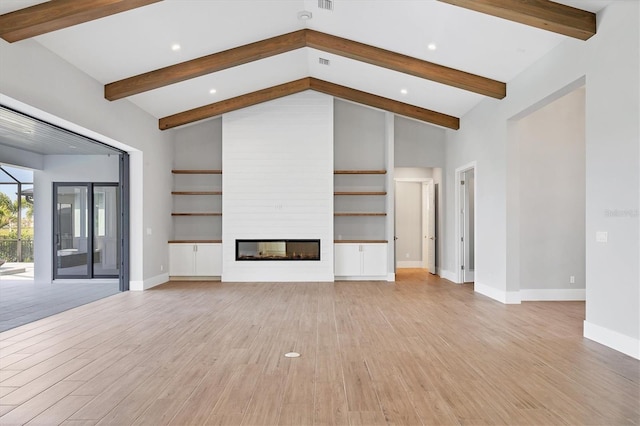 1613 4th St E, Palmetto, FL 34221 - unfurnished living room featuring light wood-type flooring, baseboards, a large fireplace, and recessed lighting