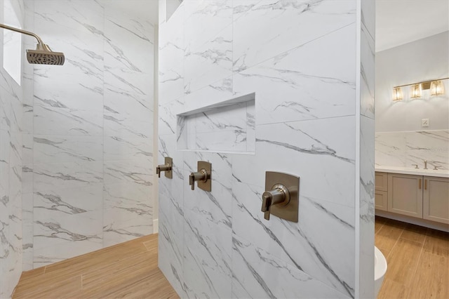 1613 4th St E, Palmetto, FL 34221 - full bath with a marble finish shower, vanity, and wood finished floors