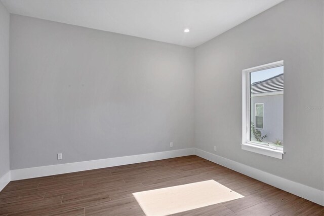 1613 4th St E, Palmetto, FL 34221 - unfurnished room featuring wood finished floors, baseboards, and recessed lighting