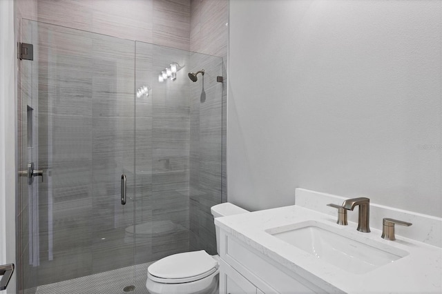 1613 4th St E, Palmetto, FL 34221 - bathroom featuring toilet, a stall shower, and vanity
