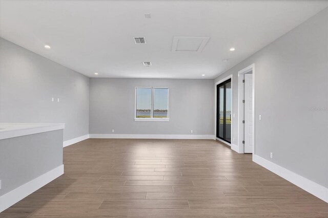 1613 4th St E, Palmetto, FL 34221 - unfurnished room featuring recessed lighting, wood finished floors, and baseboards