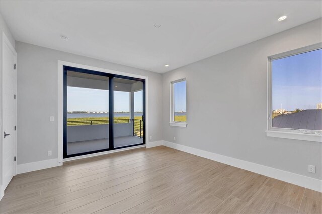1613 4th St E, Palmetto, FL 34221 - unfurnished room featuring wood finished floors, baseboards, and recessed lighting