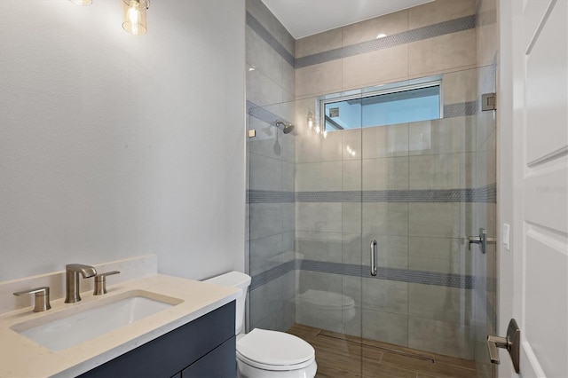 1613 4th St E, Palmetto, FL 34221 - bathroom featuring a shower stall, toilet, and vanity