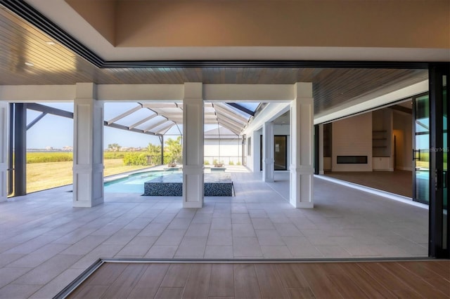 1613 4th St E, Palmetto, FL 34221 - view of patio / terrace featuring an outdoor pool and glass enclosure