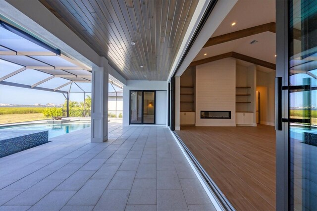1613 4th St E, Palmetto, FL 34221 - view of patio / terrace with an outdoor pool and glass enclosure