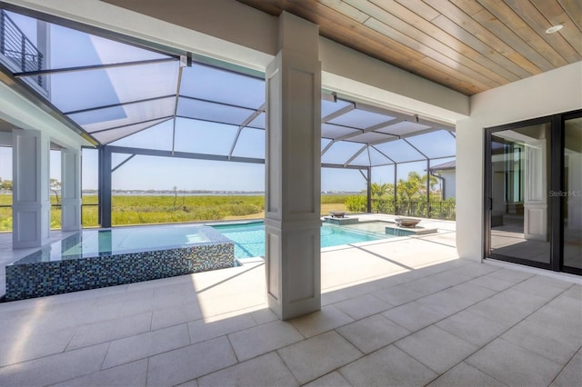 1613 4th St E, Palmetto, FL 34221 - view of swimming pool with a pool with connected hot tub, a patio, and glass enclosure
