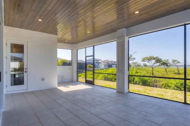 1613 4th St E, Palmetto, FL 34221 - unfurnished sunroom with plenty of natural light