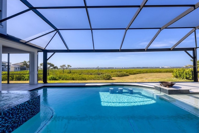 1613 4th St E, Palmetto, FL 34221 - view of pool featuring a pool with connected hot tub, glass enclosure, and a patio area