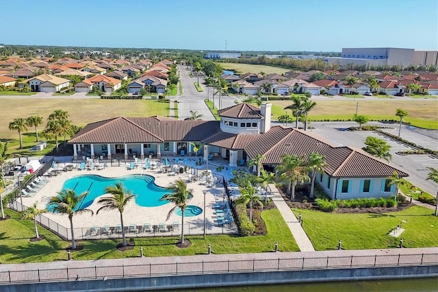 1613 4th St E, Palmetto, FL 34221 - aerial view of residential area with a pool area