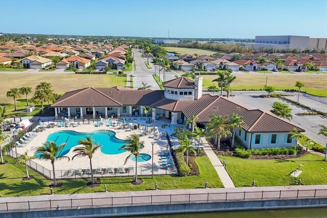1613 4th St E, Palmetto, FL 34221 - aerial view of residential area with a pool