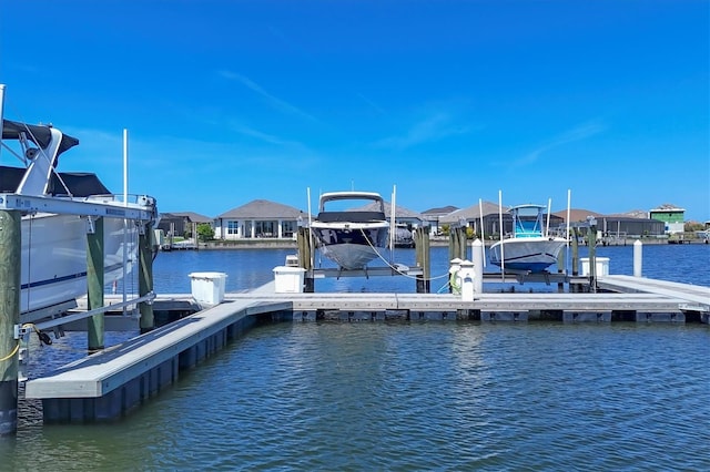 1613 4th St E, Palmetto, FL 34221 - dock area with boat lift, a water view, and a residential view