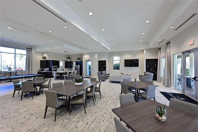 dining room with recessed lighting, french doors, and a tray ceiling