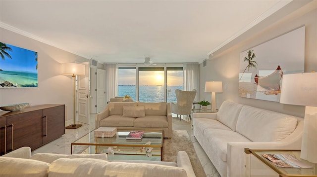 99 Sunset Dr Unit 102, Sarasota, FL 34236 - living area featuring crown molding, ceiling fan, a water view, marble finish flooring, and baseboards