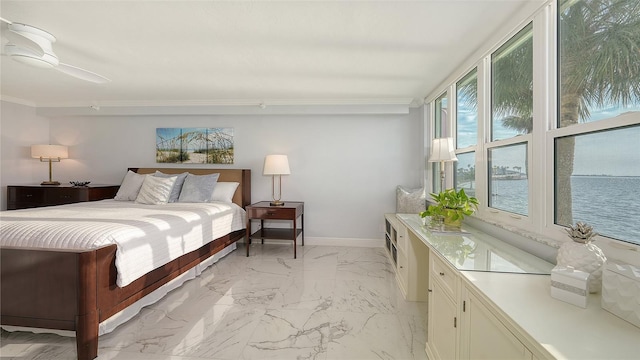 99 Sunset Dr Unit 102, Sarasota, FL 34236 - bedroom with ornamental molding, light marble finish floors, and baseboards